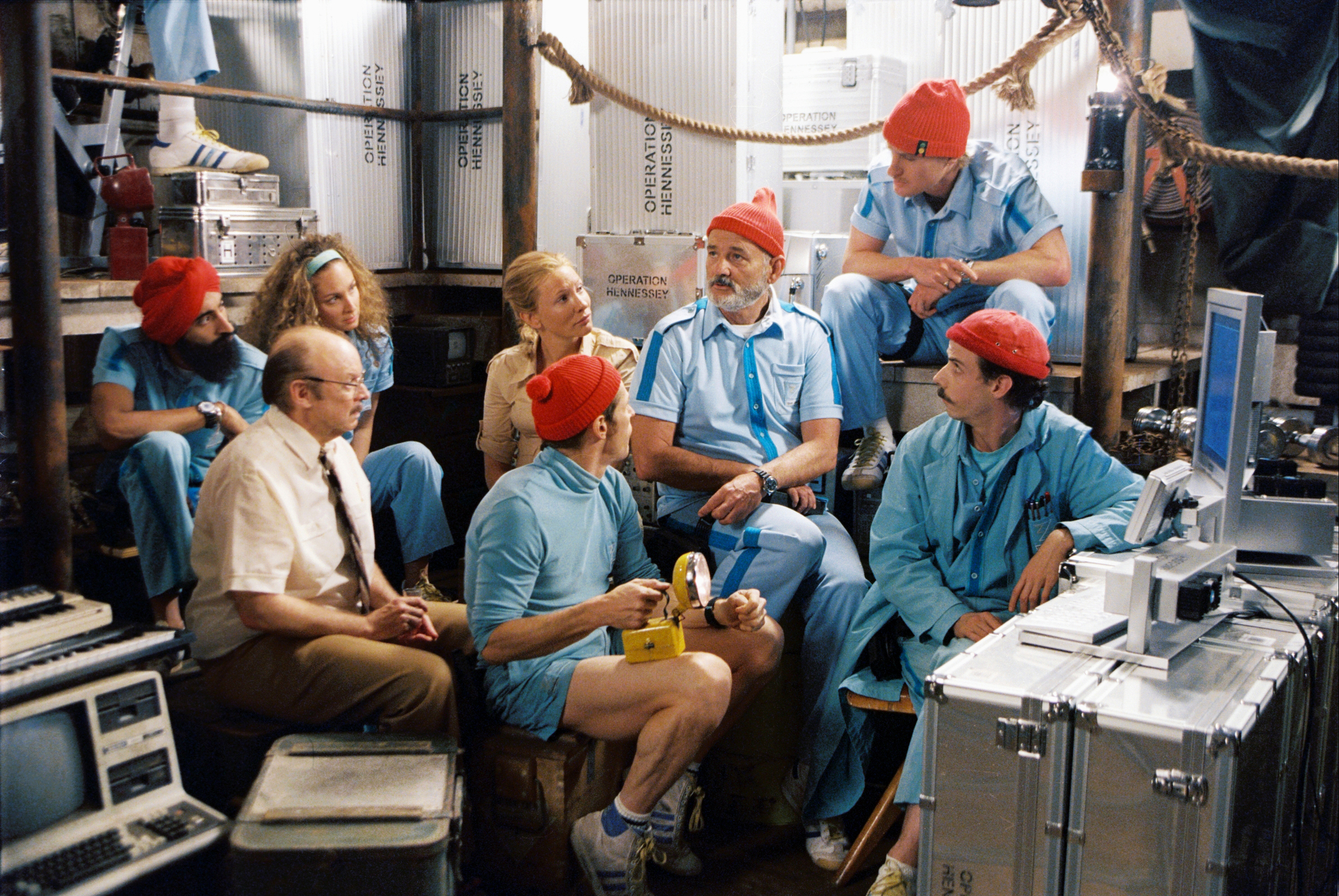 Team Zissou in a meeting to prepare the mission